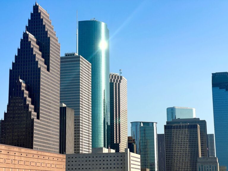Stunning view of Houston's skyscrapers under clear blue sky.